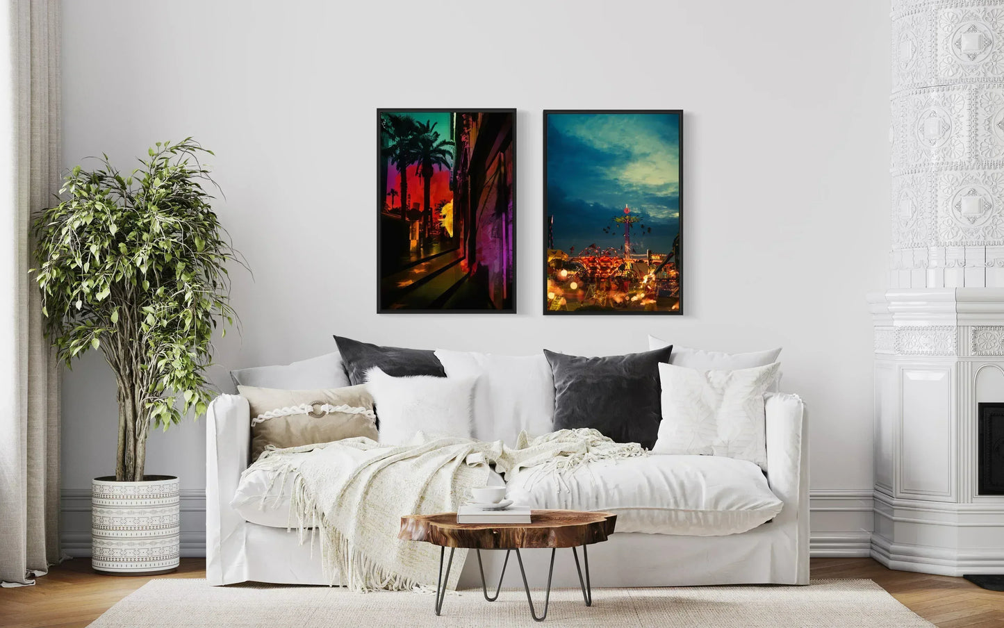 Living room with a white sofa, decorative pillows, a coffee table, and two colorful wall art pieces.